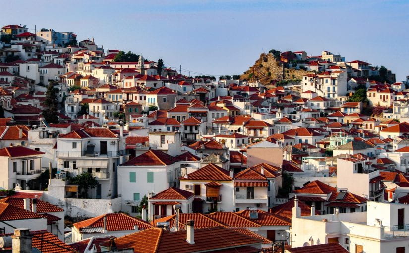 The orange roofs of Skopelos take on many shapes. Gable, mansard, or hip-shaped roofs are covered in the traditional S-shaped tile., mission, or flat French tiles.
