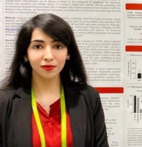 Close up of Maheen in front of a research poster.