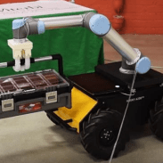 Robot moving a tool box across the floor